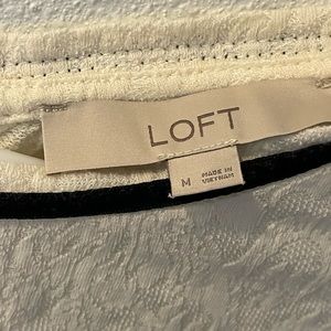 A white Loft shirt with a black collar